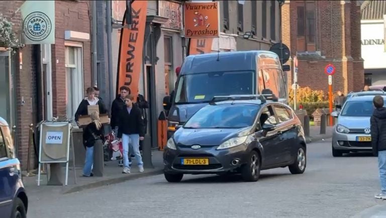 A van discharges fireworks in the Molenstraat in Baarle Hertog (photo: editors).