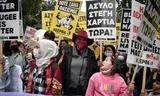 Dutch Greece correspondent Ingeborg Beugel (center) in 2021 during a protest in Athens. Photo Louisa Gouliamaki/AFP 