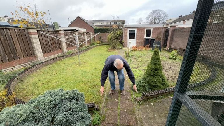 Jaap shows the rails that go straight through his backyard and shed (photo: Megan Hanegraaf).