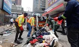 Cops and garbage collectors remove sleeping places and belongings from homeless people in Johannesburg. 