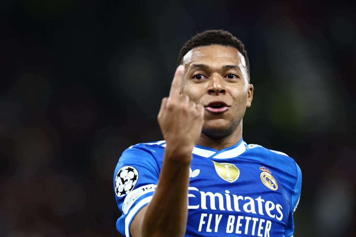 Kylian Mbappé celebrates a goal against Olympiacos