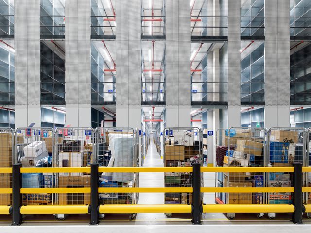 On the work floor while inspecting and organizing returned packages at BOL.COM. 