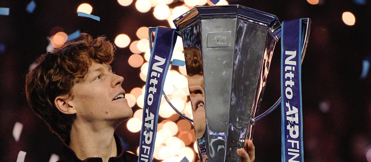 Jannik Sinner holds the ATP Finals trophy