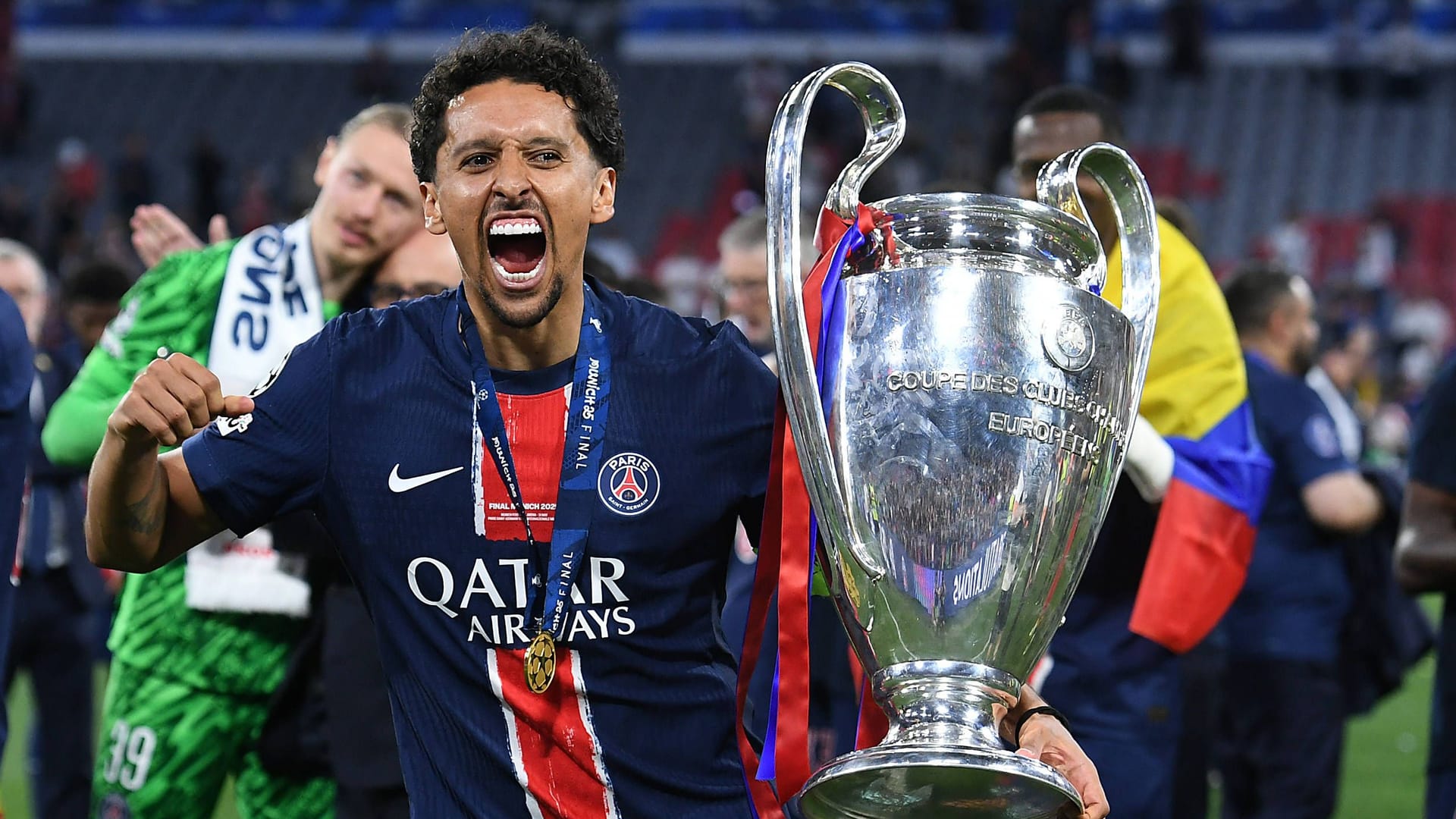 Marquinhos celebrates with the Champions League trophy: Paris Saint-Germain is the current defending champion.