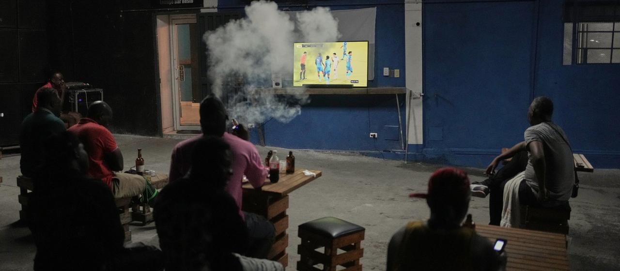 Haitians watch their country's World Cup qualifier in the capital Port-au-Prince