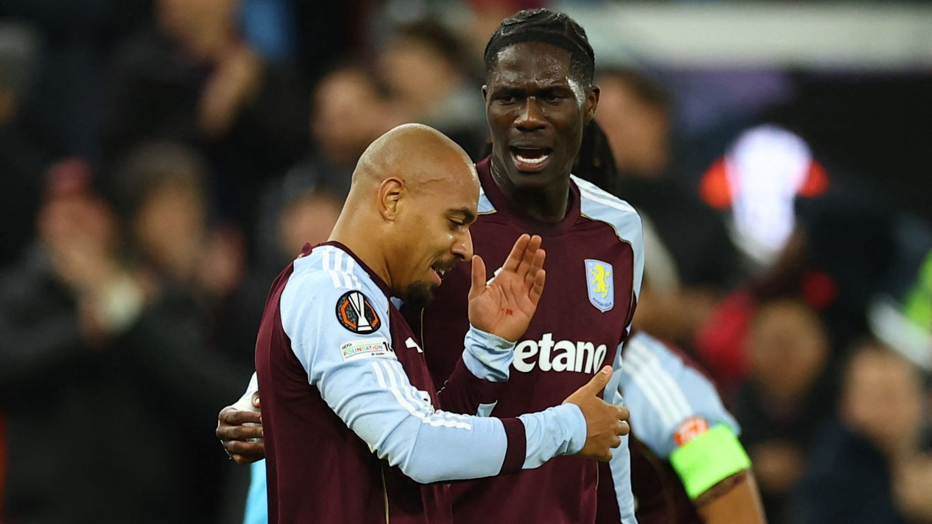 Blood on the hand: Aston Villa's Malen (left) after the goal with teammate Amadou Onana.