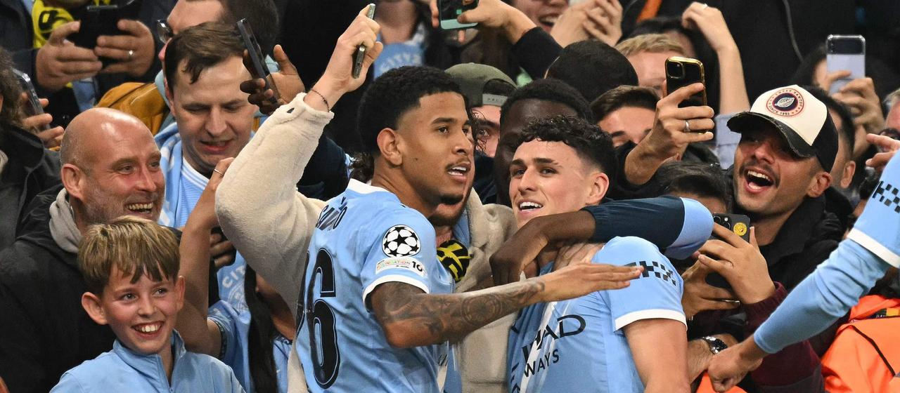 Phil Foden celebrates with the fans after his goal