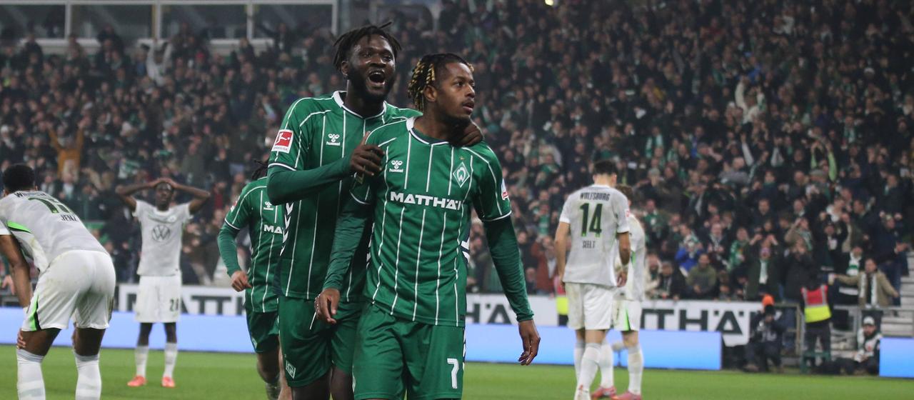 Samuel Mbangula celebrates his goal with Victor Boniface