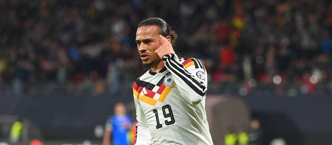 Leroy Sane celebrates his goal to make it 3-0 in the game against Slovakia