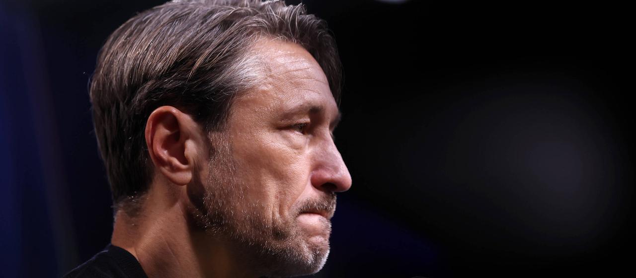Niko Kovac seen from the side at a press conference