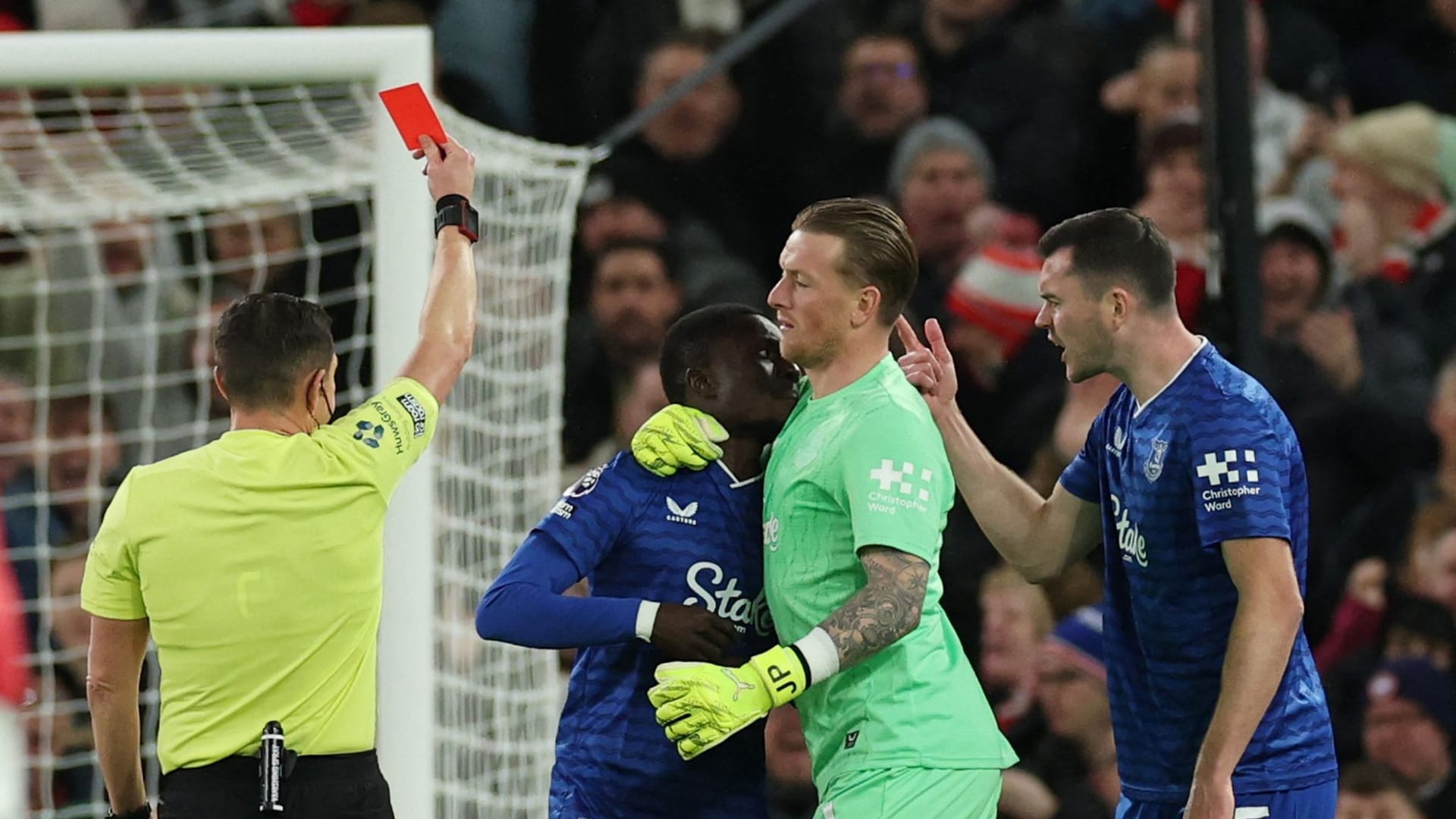 Idrissa Gueye (left) sees the red card: He had a clash with Michael Keane (right).