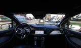 A self-driving Jaguar taxi from tech company Waymo drives through Los Angeles.