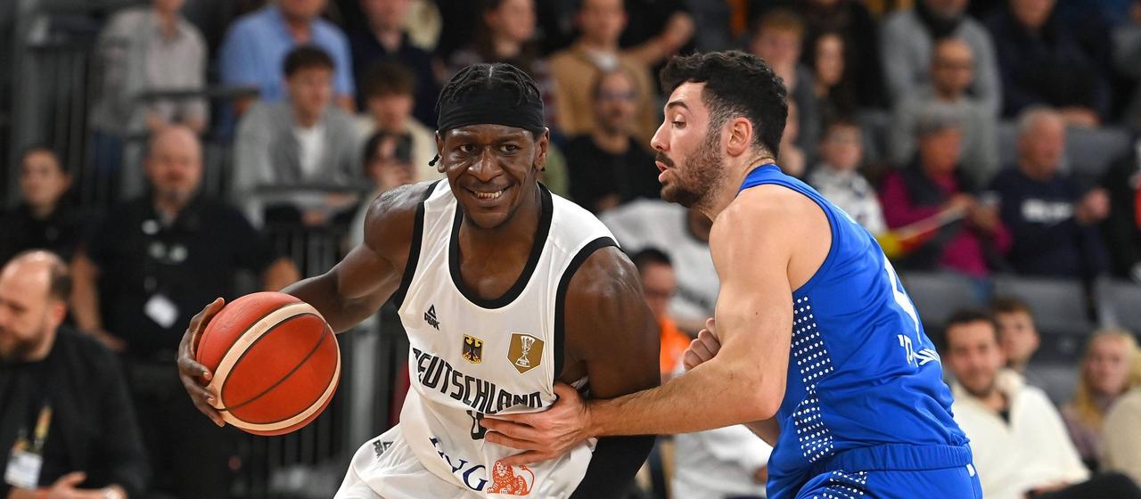 Germany's Isaac Bonga in action against Israel's Gur Lavi