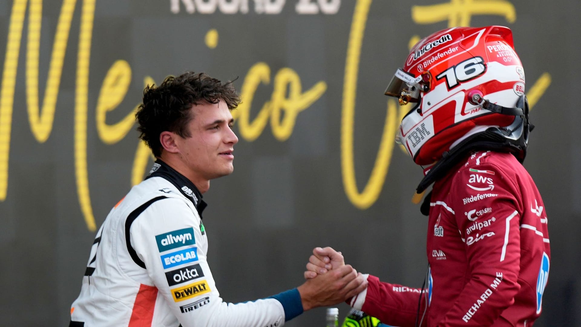 The British McLaren driver Lando Norris (l), who won pole position, is congratulated by the Ferrari driver Charles Leclerc (Monaco).