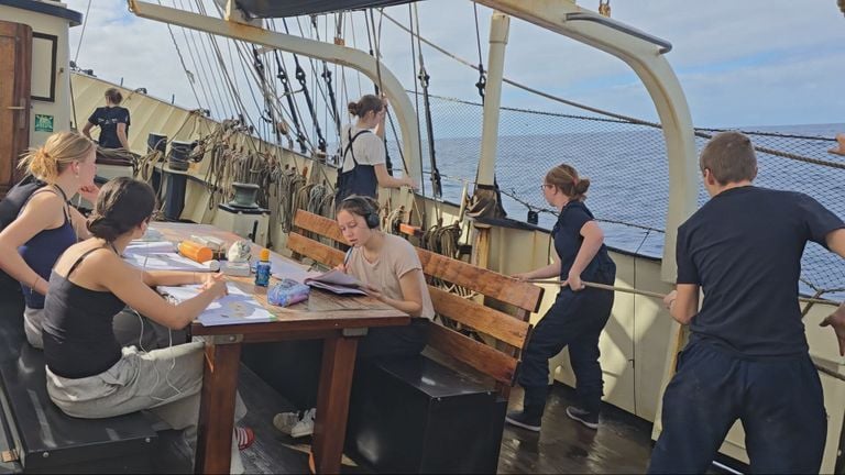 The students working on the boat (photo: School at Sea).