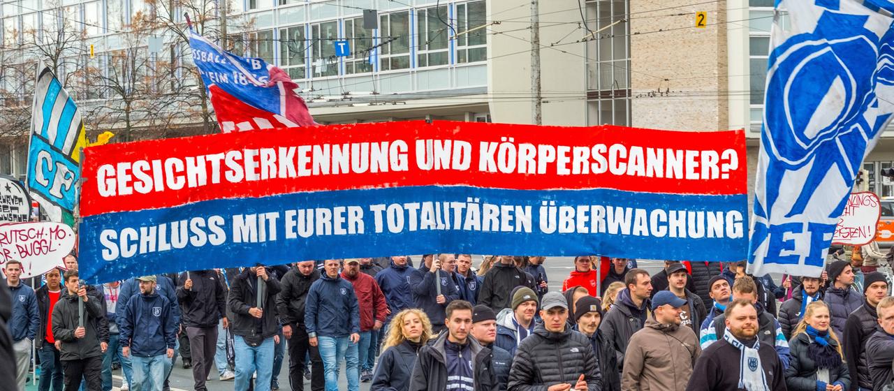 Two text banners with the inscription "Facial recognition and body scanners?"
