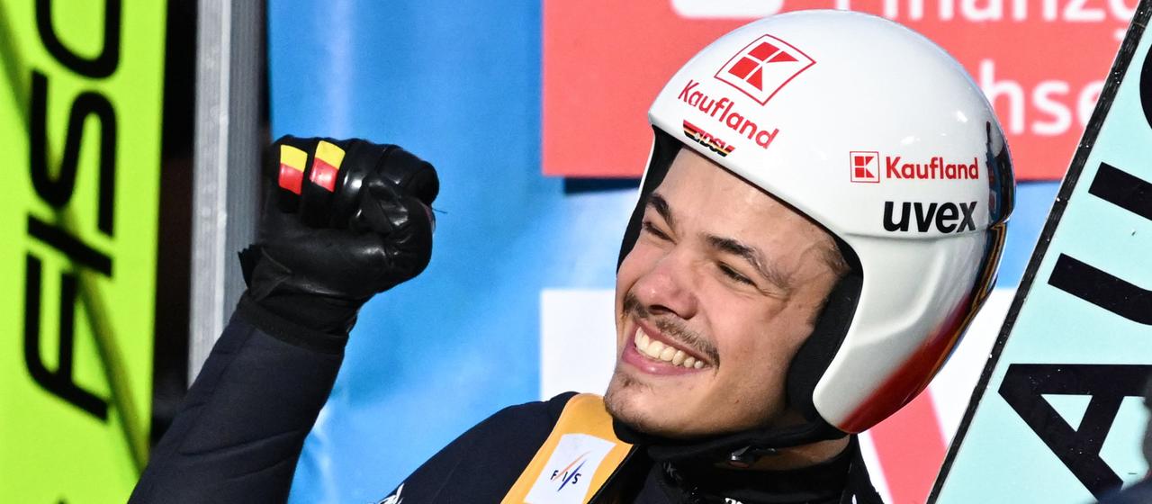 Philipp Raimund celebrates after his jump