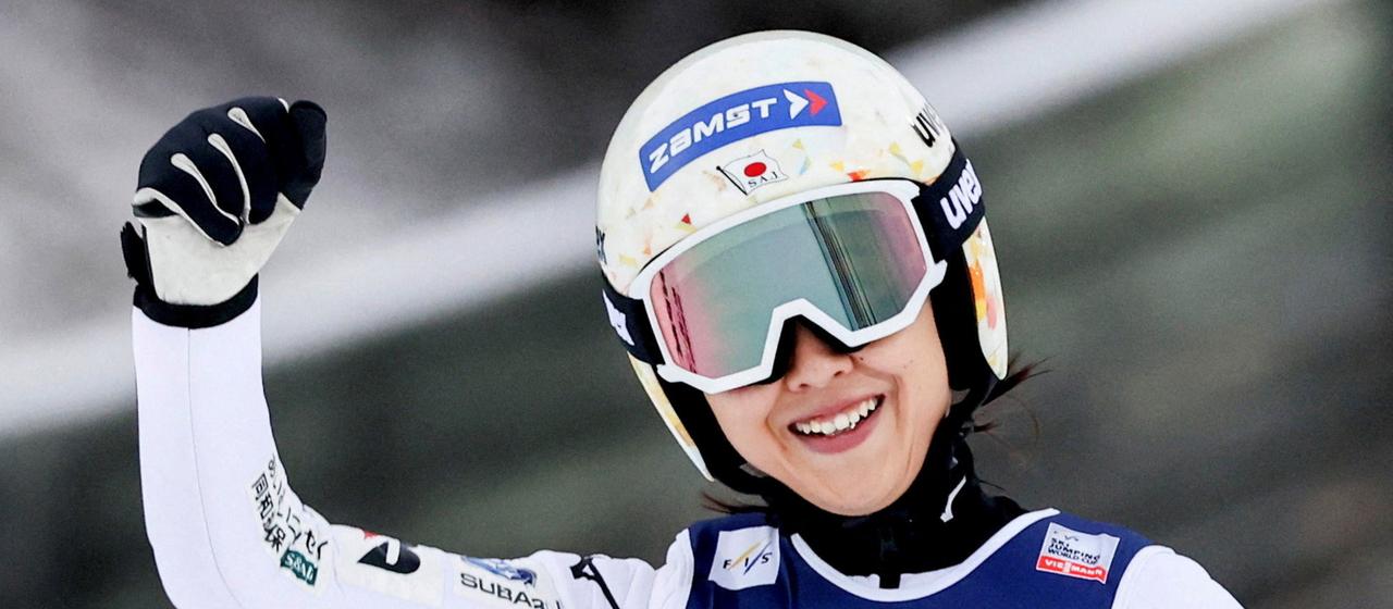 Nozomi Maruyama celebrates after a jump