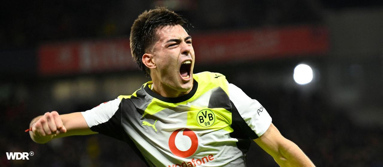 Dortmund's Aaron Anselmino celebrates his goal in Leverkusen