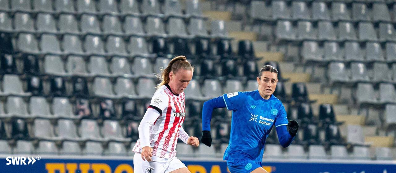 Luca Birkholz from SC Freiburg (left) in a duel with Selina Ostermeier from Bayer Leverkusen