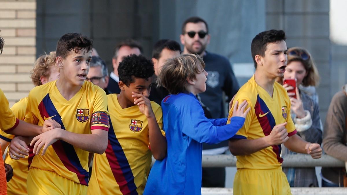 Tomi Marqués, in blue, celebrates a goal for Infantil A