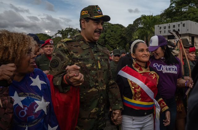 Venezuelan President Nicolás Maduro takes part in a government-organized civil-military march in Caracas, November 25.