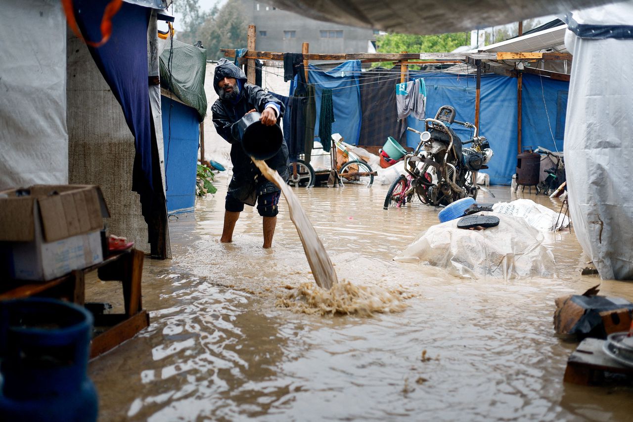 The tents filled with muddy water in Nuseirat, in central Gaza. 
