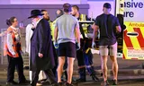 Emergency workers help an injured person into an ambulance after a shooting incident on Sydney's Bondi Beach on Sunday.