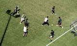 Young people play football on a field at the Amsterdam football club AFC. 