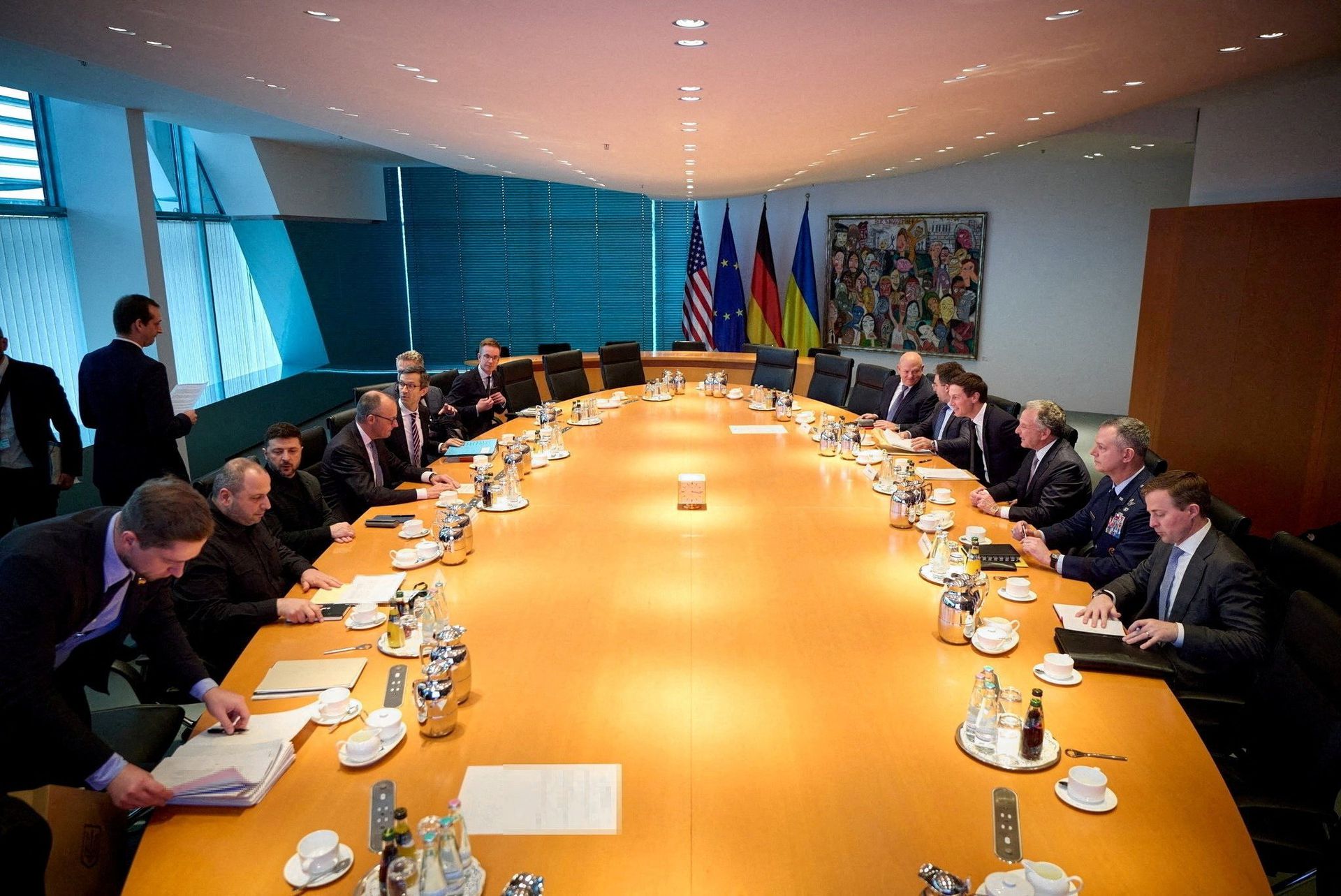In Berlin, Zelensky sat with Merz on one side of the negotiating table, the Americans sat on the other side.