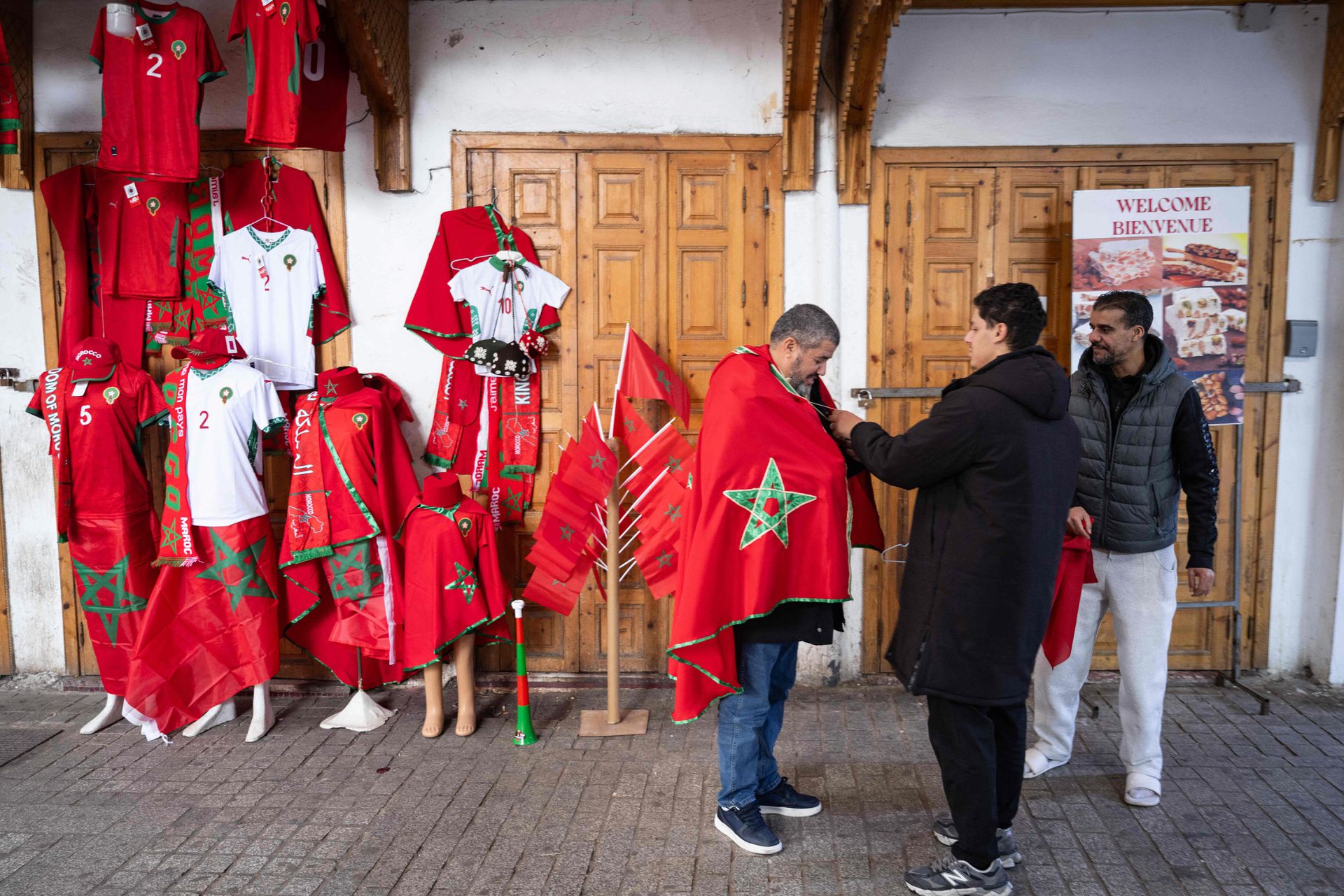 A man carries a Moroccan flag in a street of the old medina in Rabat on Friday, ahead of the Africa Cup of Nations. 