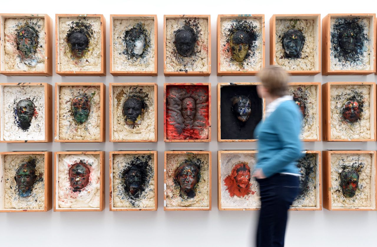 A visitor to Museum Frieder Burda in Baden-Baden in front of the work 'Kistenwalhalla' (1980/88) by Arnulf Rainer. 