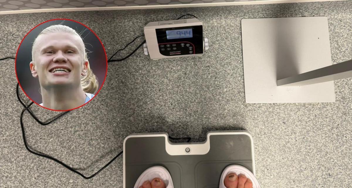 Erling Haaland, posing on the scale