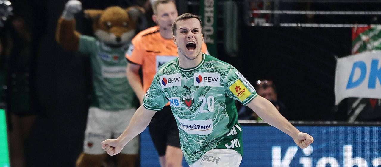 Berlin's Tim Freihöfer celebrates after scoring against THW Kiel