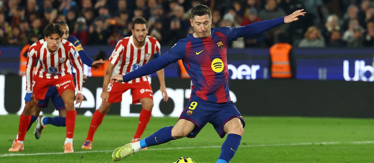 Barcelona's Robert Lewandowski scores his penalty