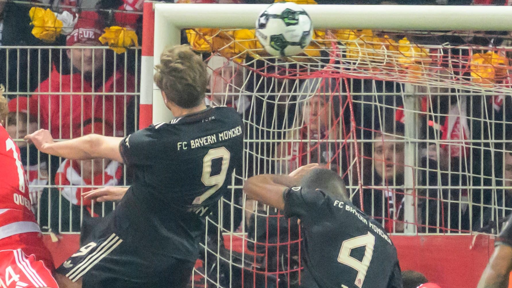 Penalty area turmoil: Bayern's Harry Kane heads the ball against Union Berlin.