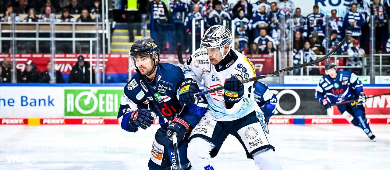 Iserlohn's Eric Cornel (left) in a duel with Dresden's Drew Leblanc