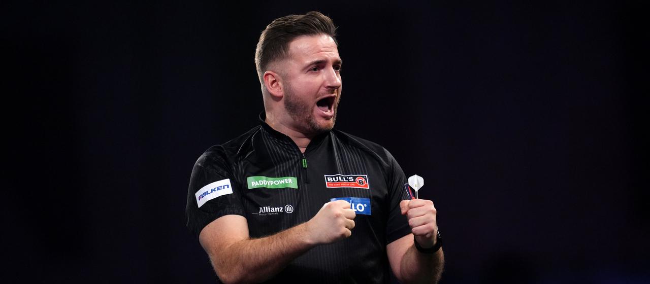Germany's Arno Merk celebrates his victory over Peter Wright