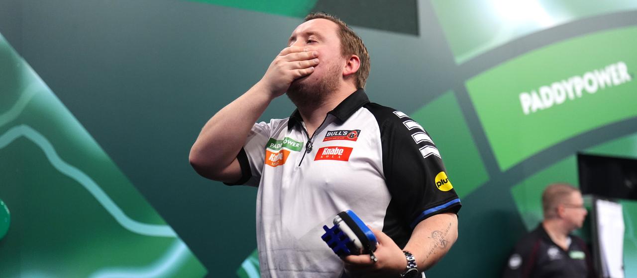 Martin Schindler reacts in disbelief after his exit from the Darts World Cup