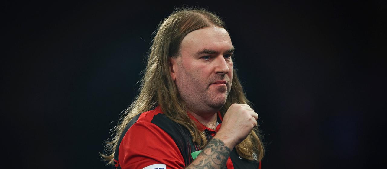 Ryan Searle clenches his fist after winning his fourth round match