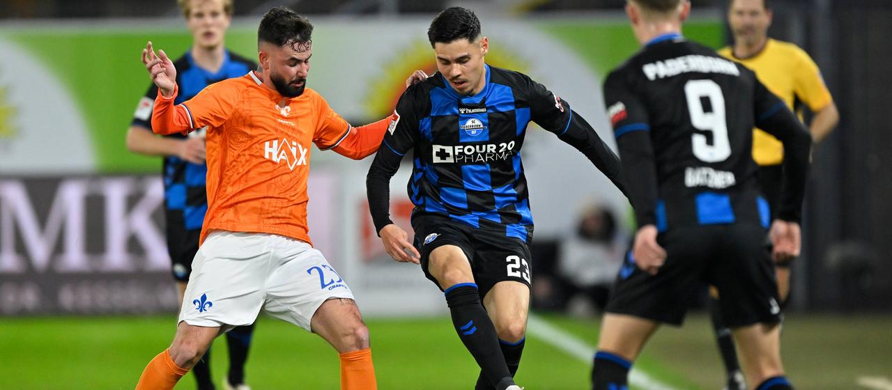 Duel between Paderborn's Raphael Obermair and Marco Richter from SV Darmstadt 