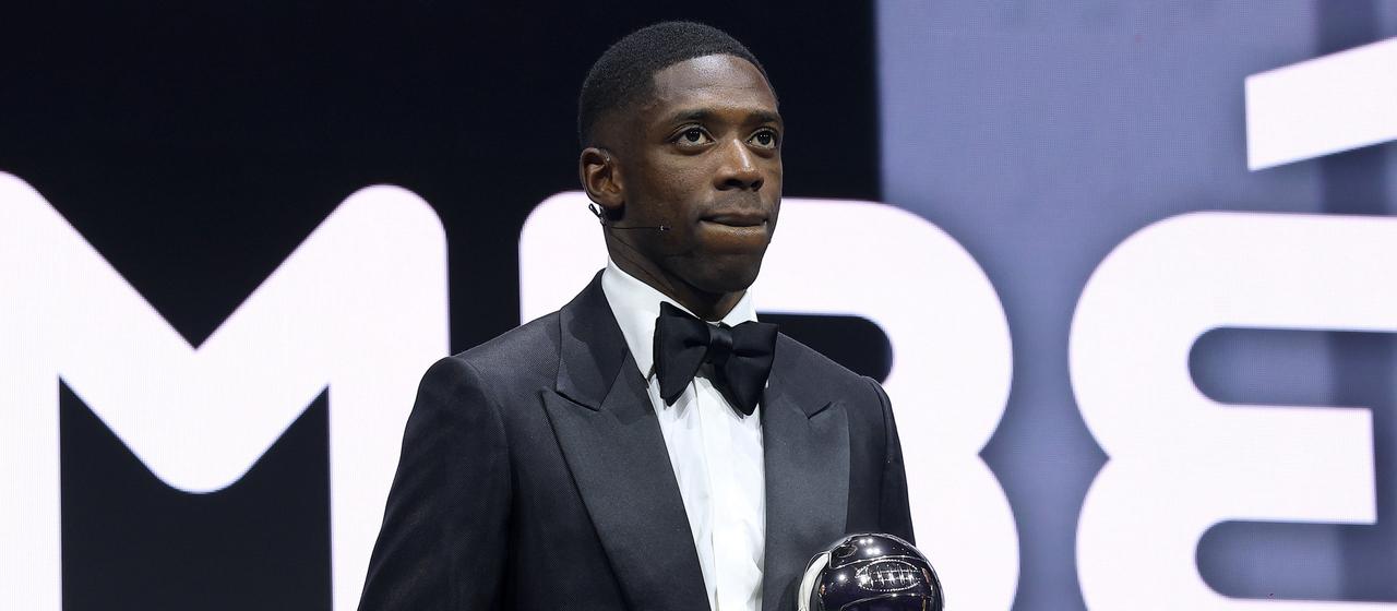Ousmane Dembele holds the FIFA World Player of the Year trophy