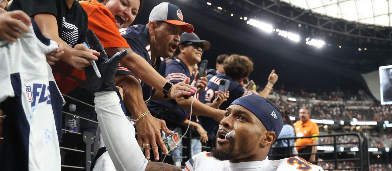 Bears' Jonathan Owens celebrates with fans