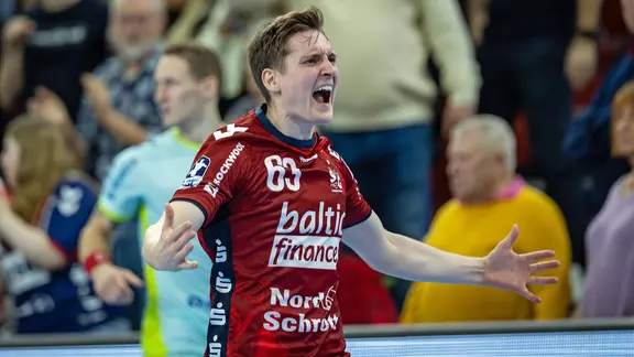 Flensburg's Domen Novak cheers.