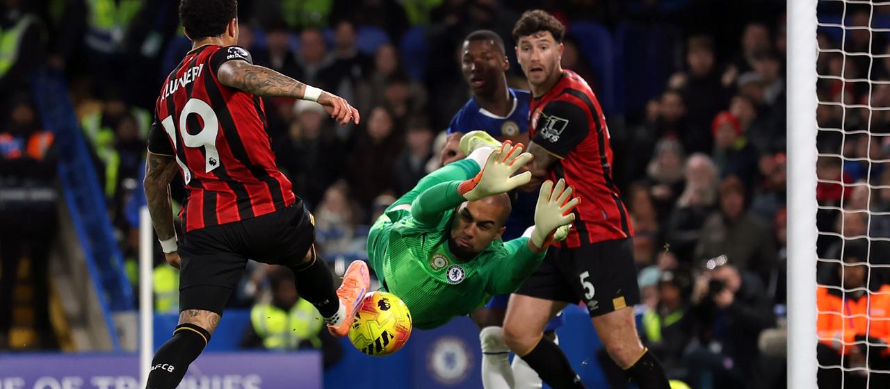 Bournemouth's Justin Kluivert (l) scores the second goal against Chelsea's goalkeeper Robert Sanchez