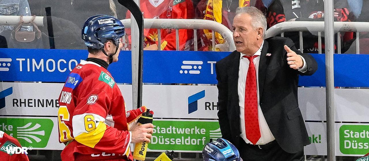 DEG coach Rich Chernomaz gives his player Kevin Maginot instructions
