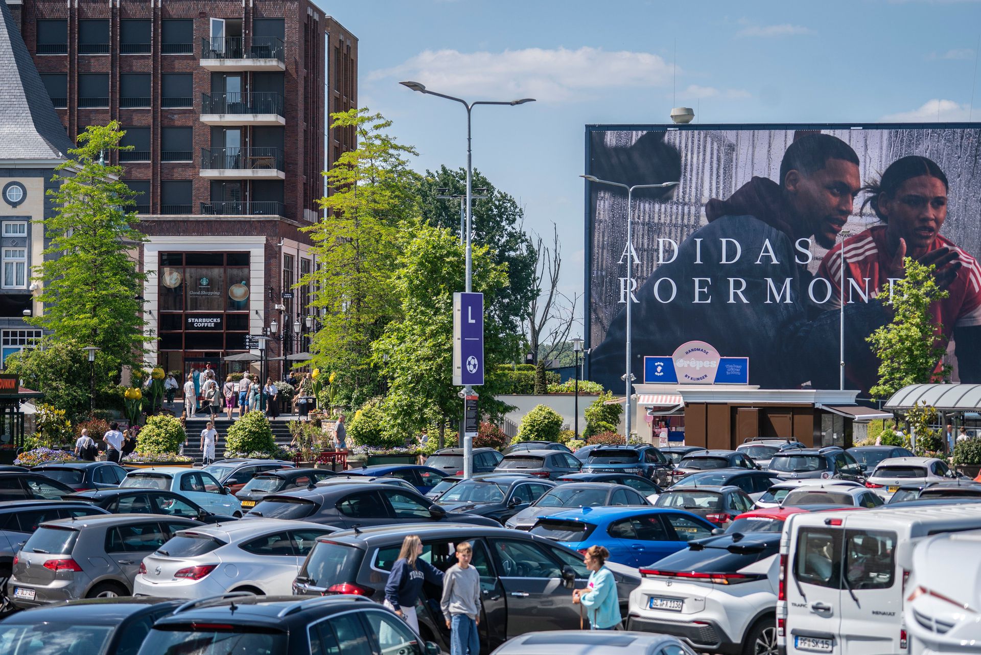   A full parking lot at Designer Outlet. 