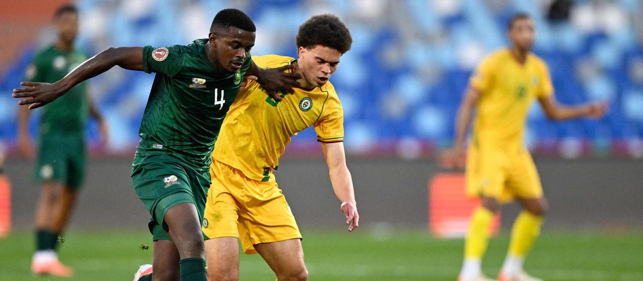 Zimbabwe's Jonah Fabisch in a duel with South Africa's midfielder Teboho Mokoena
