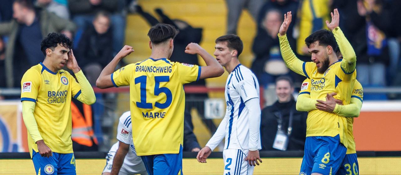 Mehmet Aydin is celebrated for his goal against Schalke