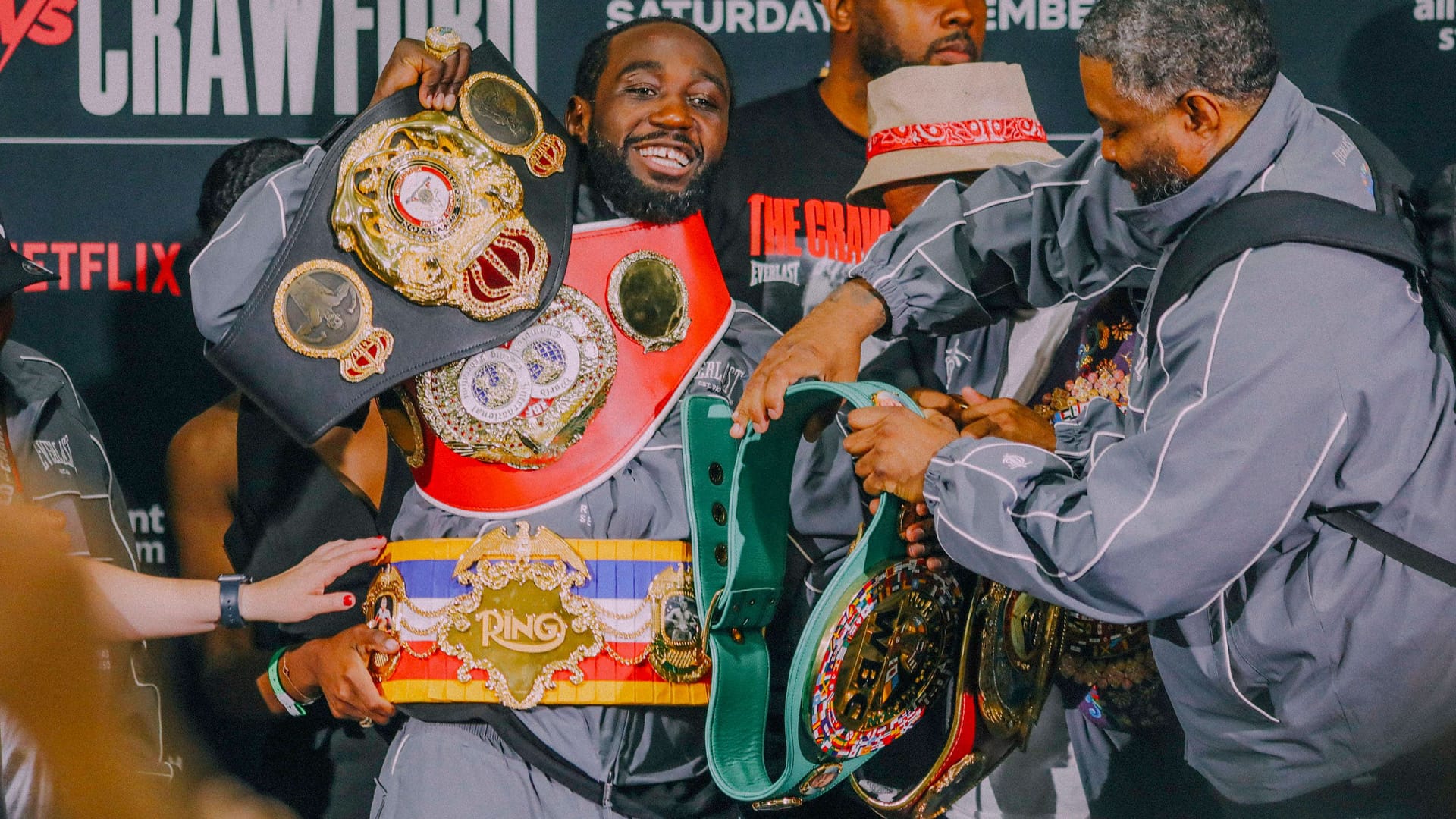 Terence Crawford with all his world championship belts: He ends his career undefeated.